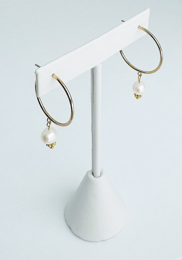 Large 14kt gold-filled hoops with freshwater pearls.