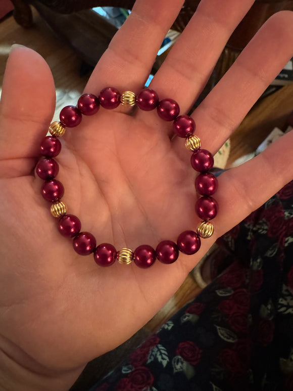 Burgundy red bracelet with gold plated accents