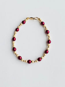 Burgundy and Gold bracelet.