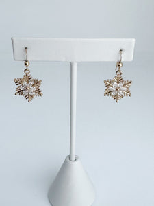 Gold and crystal snowflake earrings.