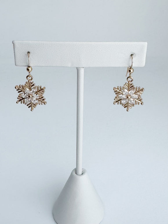 Gold and crystal snowflake earrings.