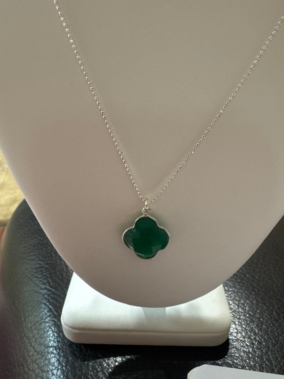 Green onyx and sterling silver 16-17mm hand-cut double-sided faceted clover on sterling silver chain. 18”-20” adjustable chain.