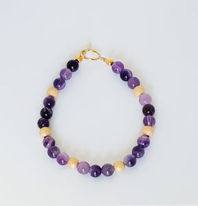Natural amethyst gemstone bracelet with 14kt gold filled accents and closure.